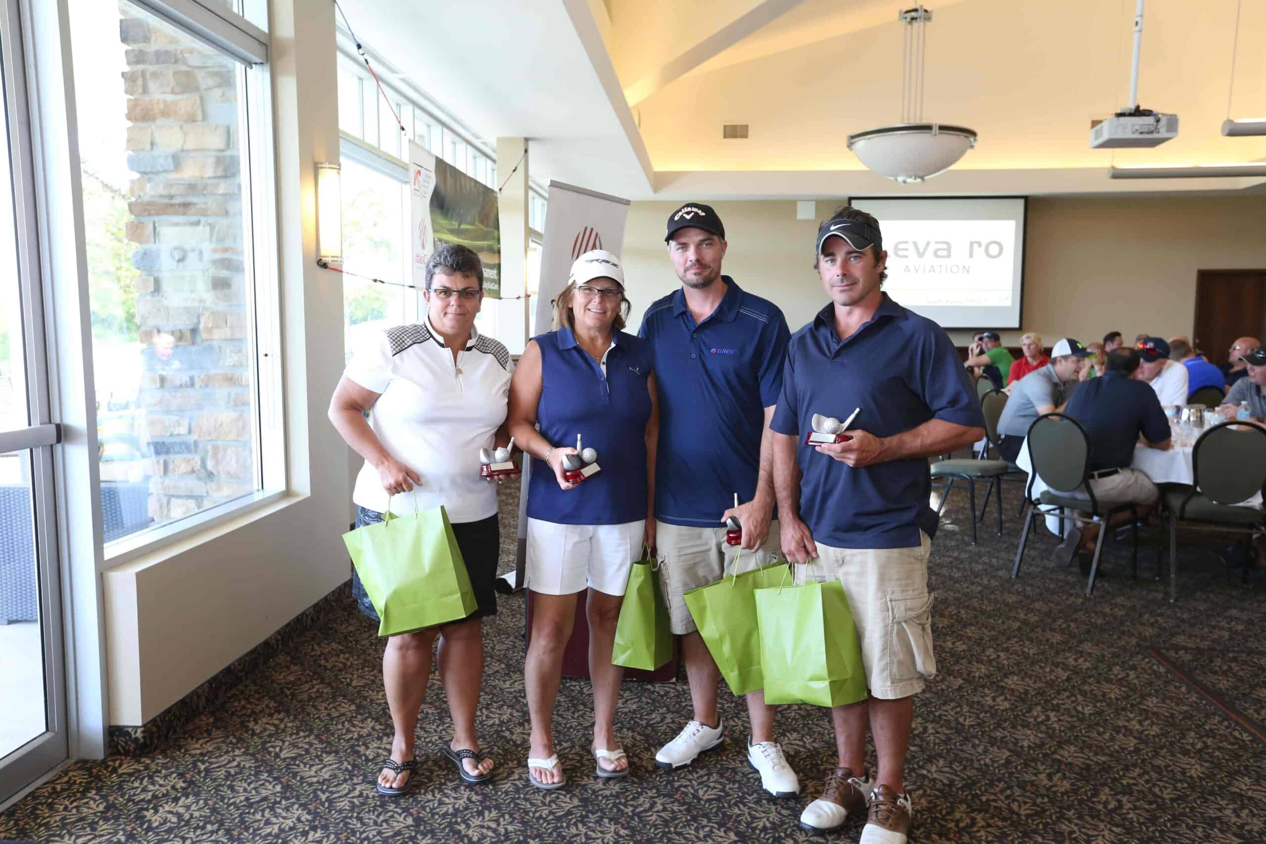 Levaero sponsors at Golf Fore MS charity event with four participants.
