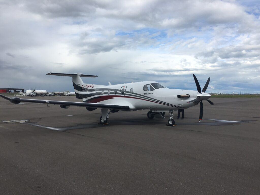 Pilatus PC-12 NG aircraft on the tarmac at CBAA event.