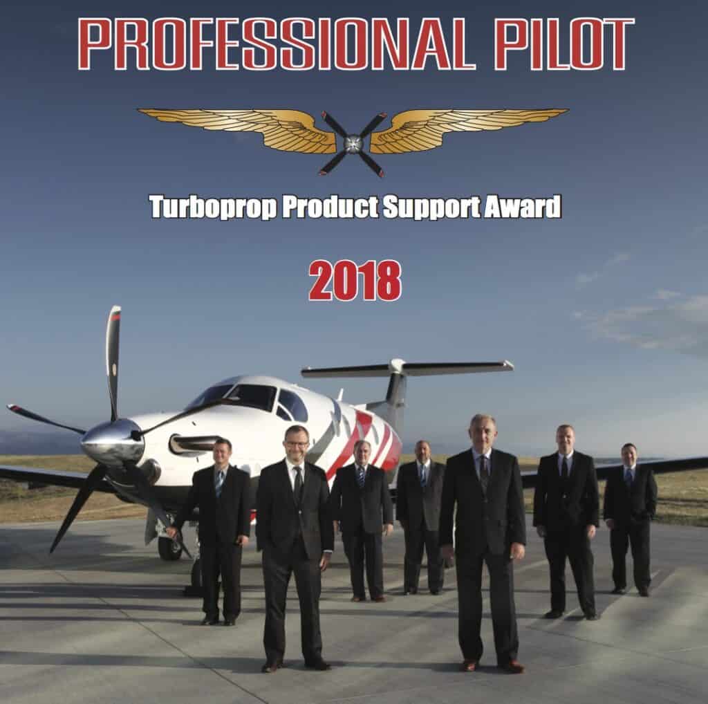 Levaero pilots receiving 2018 Turboprop Product Support Award outdoors.