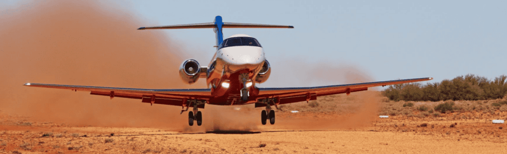 PC-24 Super Versatile Jet taking off on desert runway.