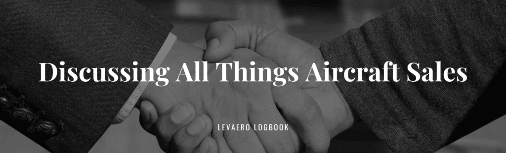 Handshake between two professionals in aircraft sales.