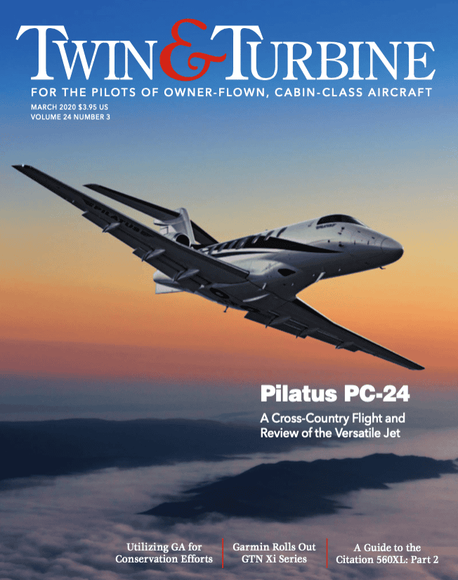 Twin & Turbine PC-24 jet in flight during sunset.