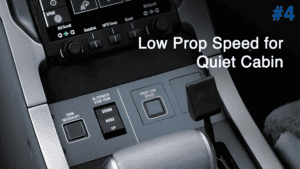 Close-up of PC-12 NGX cockpit controls with low prop speed setting.