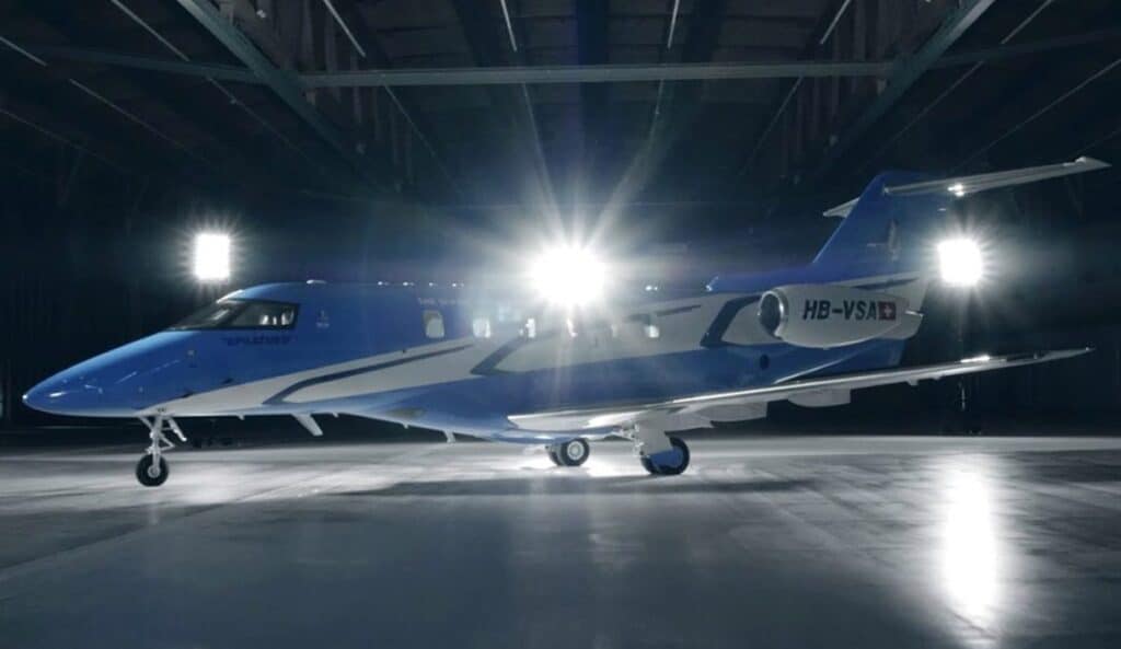 Levaero's 100th PC-24 jet delivered since 2018, showcased in a hangar.