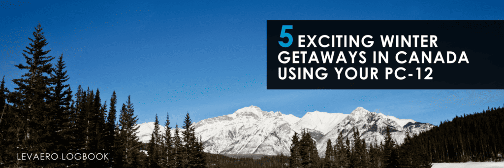 Scenic view of snow-capped mountains and forest for winter travel in Canada.