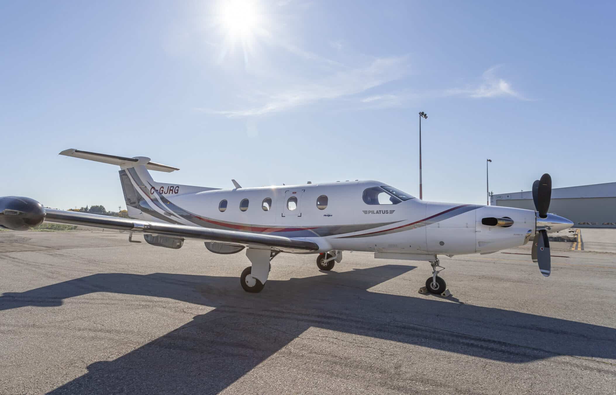 Pilatus PC-12 NG turboprop aircraft parked on the tarmac.
