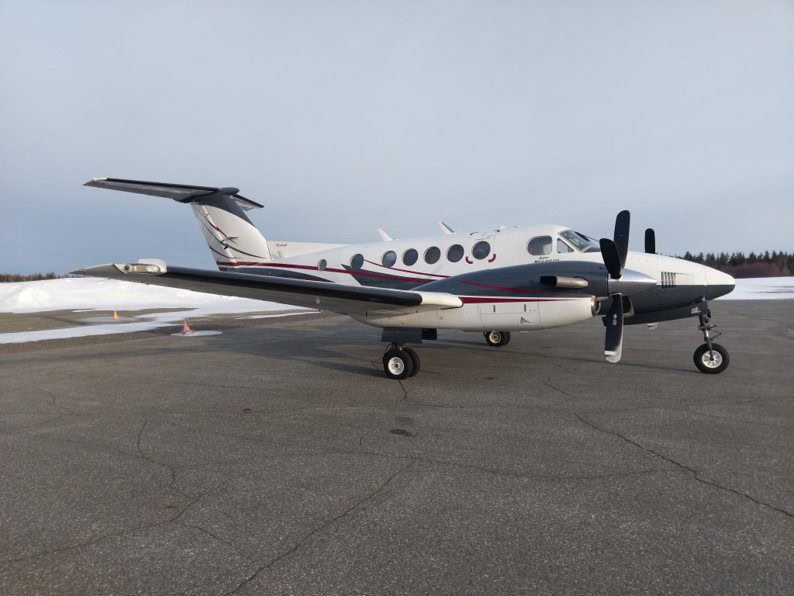 Beechcraft Super King Air B200C aircraft on tarmac, side view.