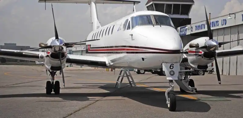 Private turboprop aircraft on the tarmac at the airport.