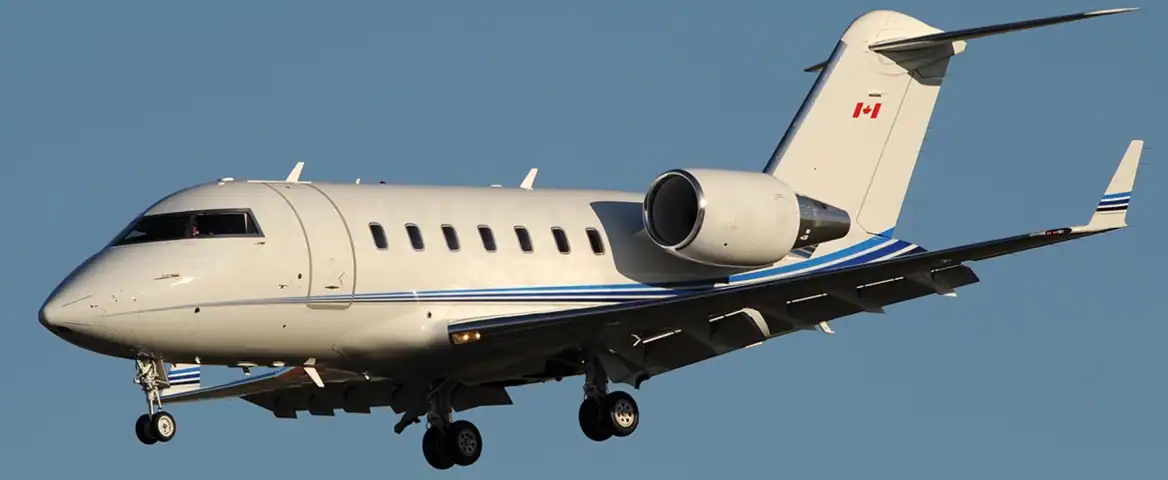 Private jet aircraft flying in clear blue sky for luxury travel.