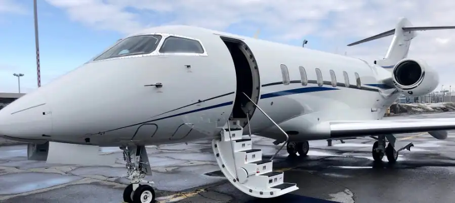 Private jet aircraft parked outdoors at Levaero Aviation facility.