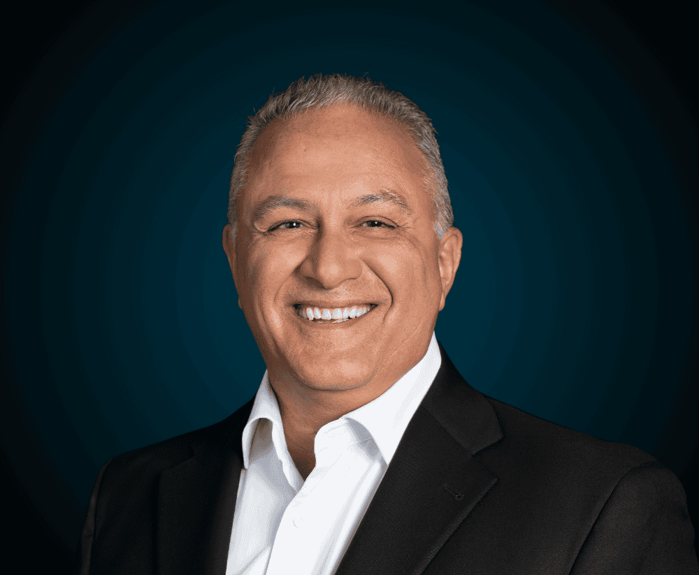 Professional man in business suit smiling for Levaero About Us page.