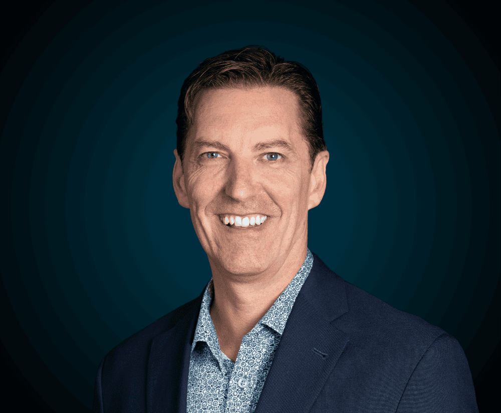 Professional Levaero team member smiling in business attire.