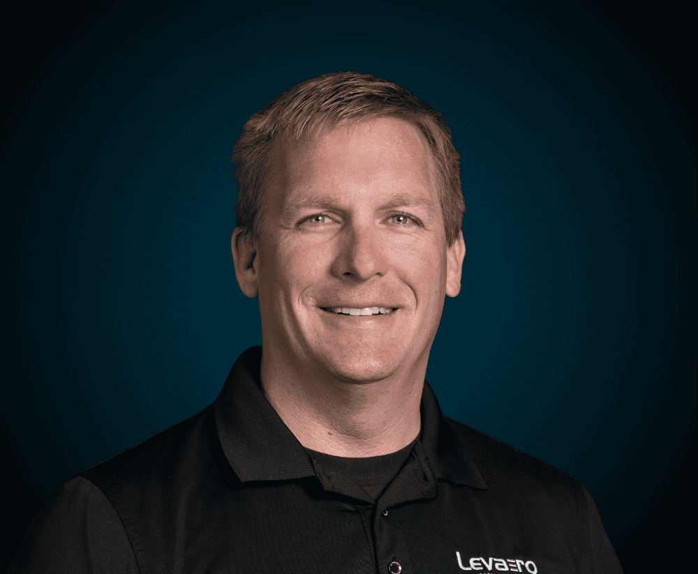 Professional Levaero team member smiling in uniform.