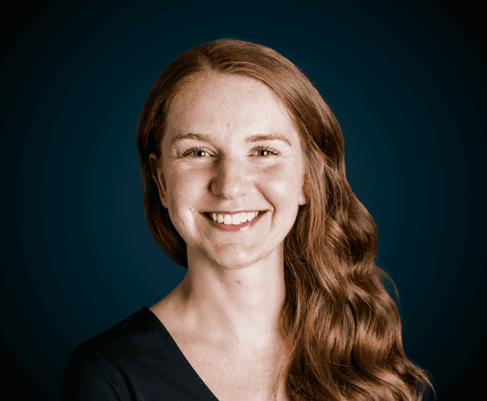 Professional woman smiling, representing Levaero's dedicated team.