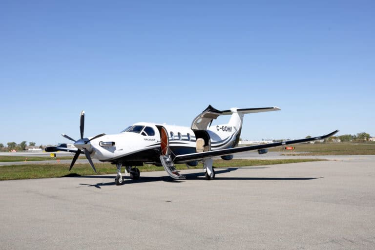 Pilatus PC-12 NG turboprop plane on tarmac.