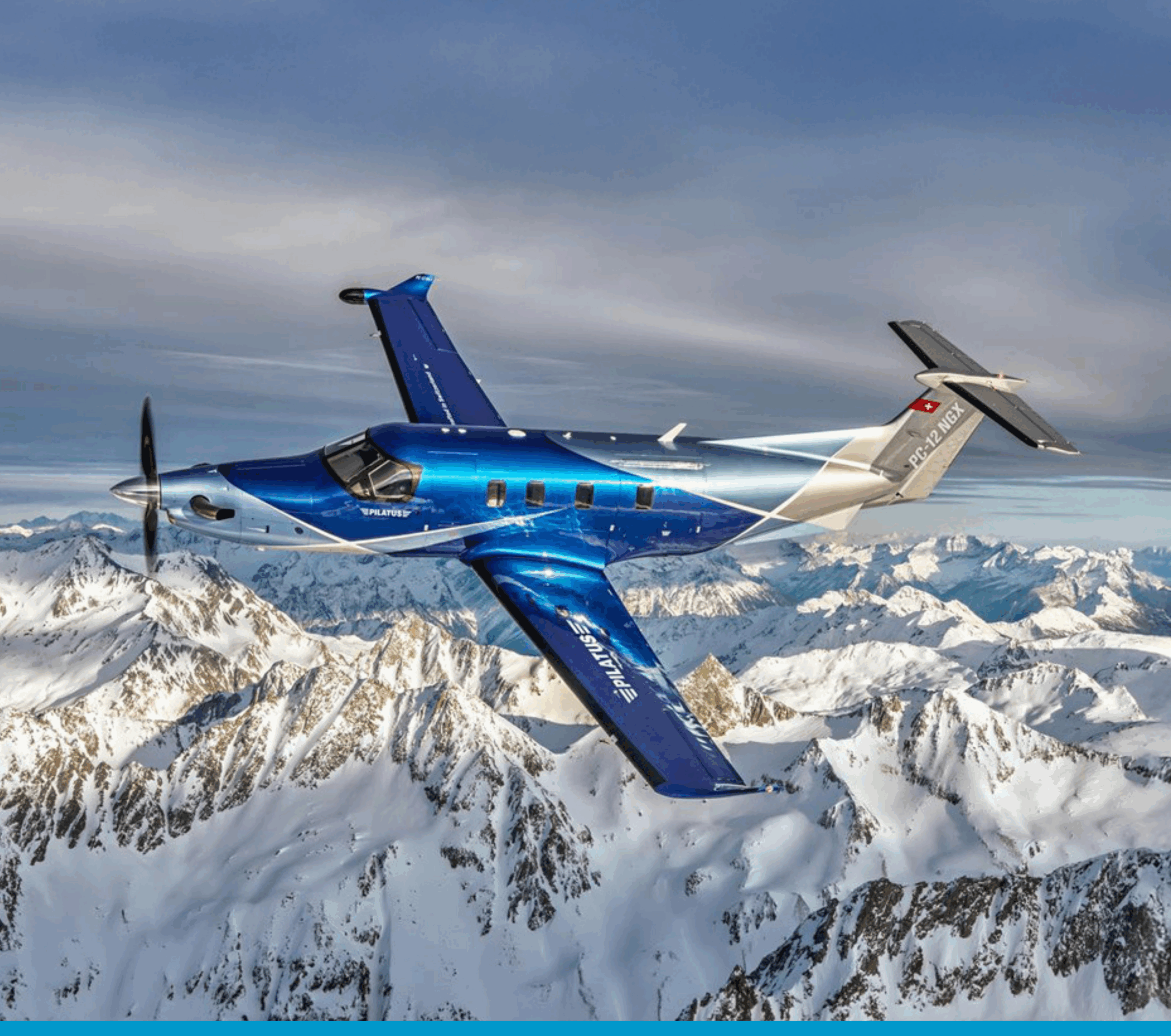 Turboprop plane soaring above snow-covered mountain range in Canadian wilderness.