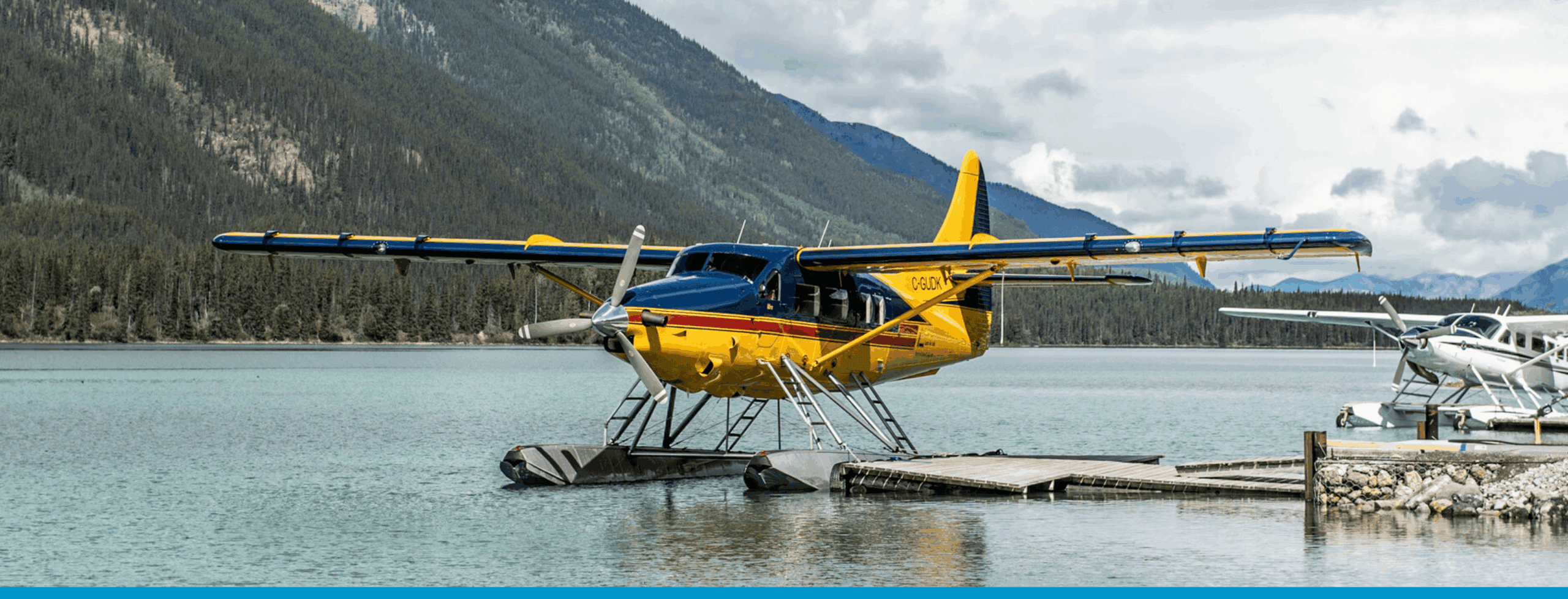 Turboprop seaplane docked on a northern lake, highlighting Canada's reliance on rugged aircraft for.