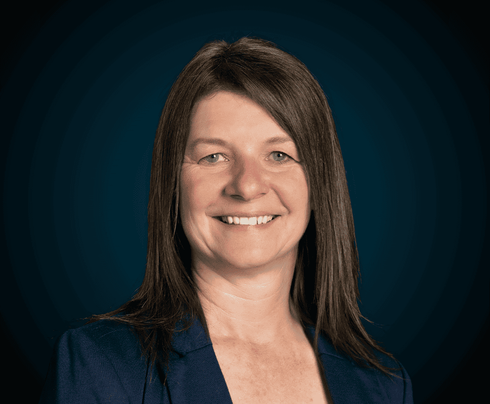 Professional woman smiling, representing Levaero team.