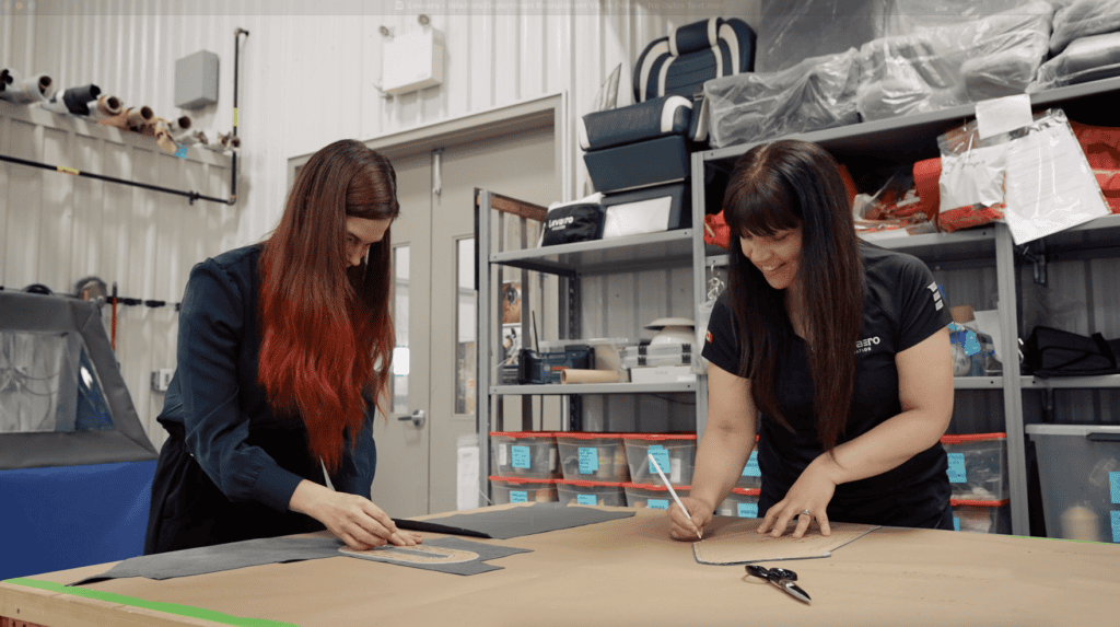 Interior workspace with two women collaborating on a design project.