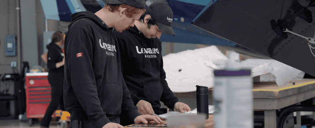 Skilled technicians performing aircraft maintenance and repairs at Levaero facility.